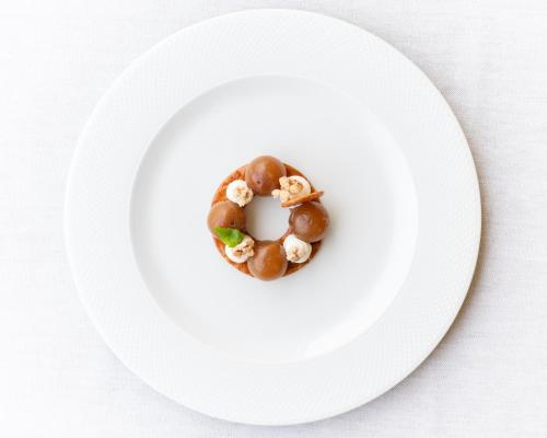 a plate of food with a donut on it at Borgo Scopeto Wine & Country Relais in Vagliagli
