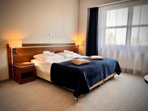 Postel nebo postele na pokoji v ubytování Hotel Szyndzielnia