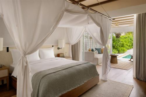 Ένα ή περισσότερα κρεβάτια σε δωμάτιο στο Six Senses Kanuhura