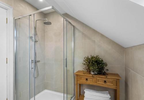 a bathroom with a shower with a glass shower stall at Sweet Garden, Mannin - Ballyconneely in Ballyconneely