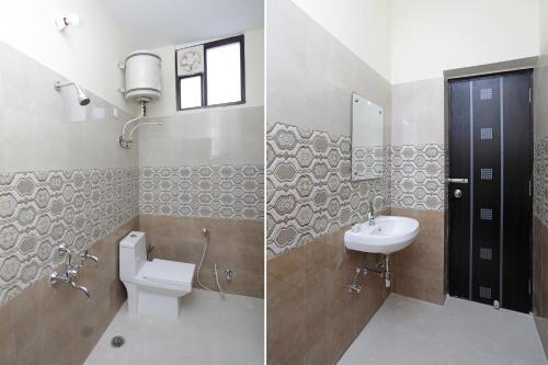 a bathroom with a sink and a toilet and a mirror at Hotel O Greenview Inn in Lucknow