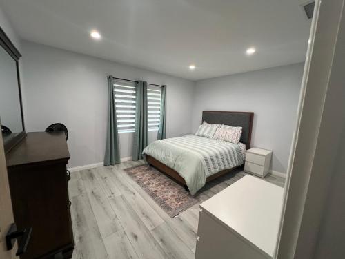 a small bedroom with a bed and a window at Lovely 2bedroom next to Santa Monica college in Los Angeles
