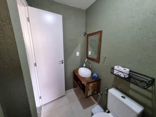 a bathroom with a sink and a toilet and a mirror at RIO Star View, Gamboa, Little Africa 2 in Rio de Janeiro
