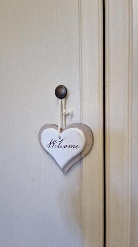 a heart shaped door knocker on a door at Trullo Grande Noce in Ostuni