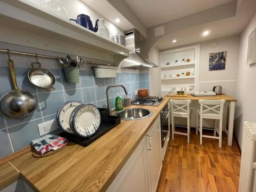 a kitchen with a sink and a counter top at Inn The Garden in Catania