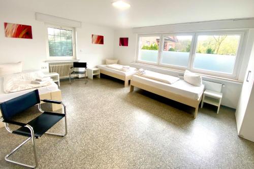 Postel nebo postele na pokoji v ubytování Monteurwohnung Haus Stallmeister in Lippstadt