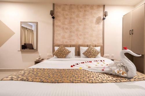 Ένα ή περισσότερα κρεβάτια σε δωμάτιο στο Hotel Seasons Inn