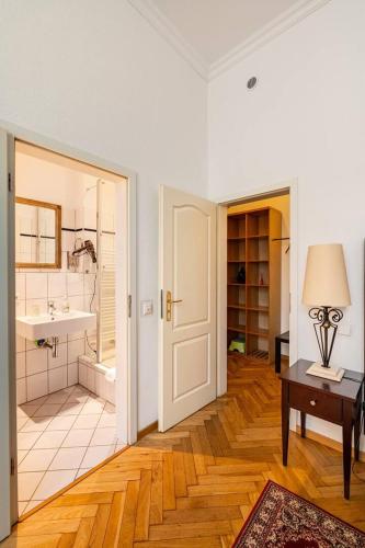 a room with a bathroom with a sink and a tub at Studio an der Therme in Baden-Baden