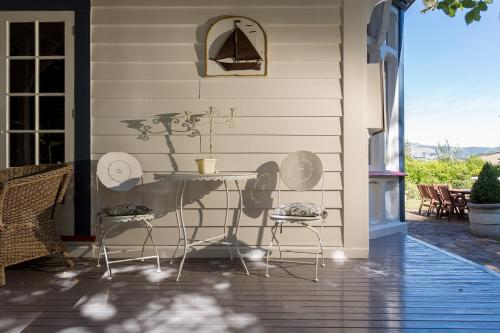 a table on the side of a house at Beaufort House Akaroa in Akaroa