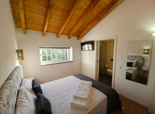 Postel nebo postele na pokoji v ubytování Casa do Chafariz - Rooms
