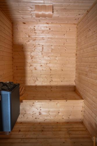 a wooden sauna with a bench in a room at B&BIO SPA in Catanzaro