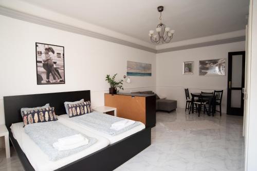 Posteľ alebo postele v izbe v ubytovaní Madach Square Residence