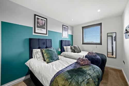 Ein Bett oder Betten in einem Zimmer der Unterkunft Stunning Penthouse in Chelmsford - Large Rooftop