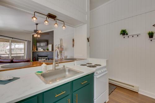 a kitchen with a sink and a stove at Cozy La Veta Condo Walk to Cuchara Mountain Park! in La Veta