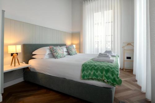 Ένα ή περισσότερα κρεβάτια σε δωμάτιο στο Casa Romano Suites