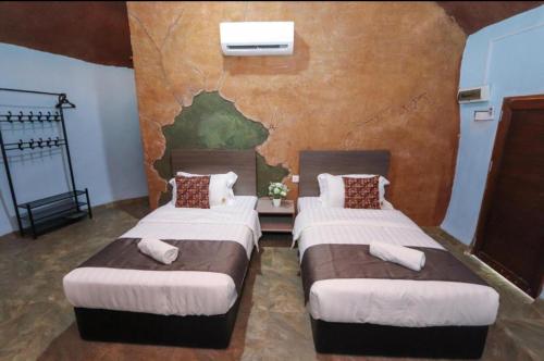 Un ou plusieurs lits dans un hébergement de l'établissement Mushroom Villa Best homestay