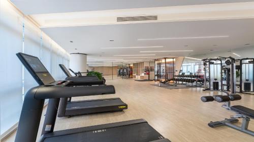 a gym with treadmills and cardio equipment in a building at EVEN Hotel Yinchuan Yuehai by IHG in Yinchuan