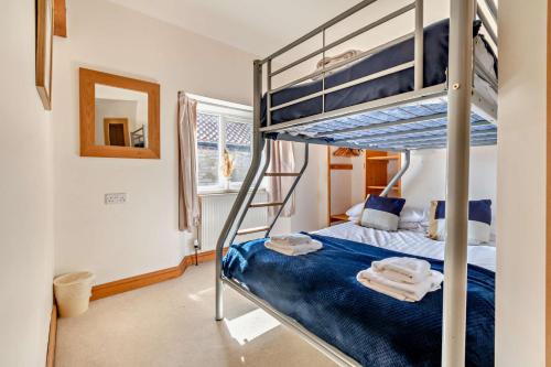 Postel nebo postele na pokoji v ubytování Starling cottage