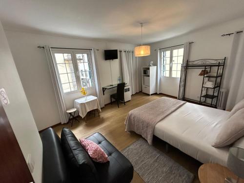 Postel nebo postele na pokoji v ubytování Palmar Rooms