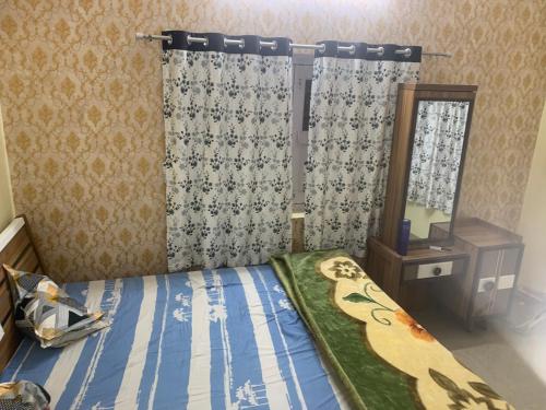 Кровать или кровати в номере Sukh garden luxury stay