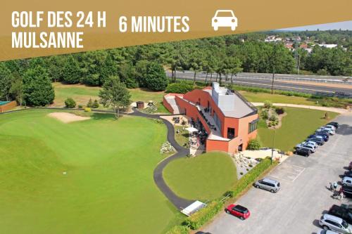 an overhead view of a golf course with a house at PADDOCK 24 Arnage - Loft Le Mans in Arnage