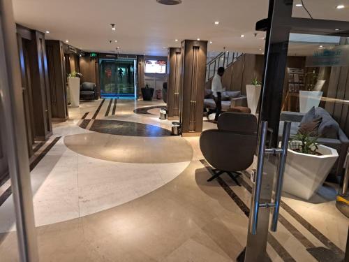 a lobby of a building with a large rug at Five Star Nile Cruise from Aswan to Luxor in Aswan