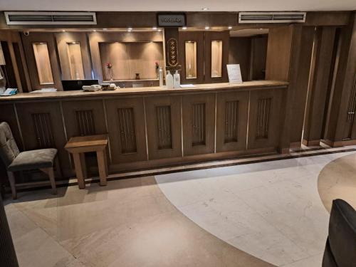 a lobby with a bar with a table and chairs at Five Star Nile Cruise from Aswan to Luxor in Aswan