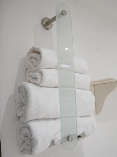 a bunch of towels are on a rack in a bathroom at Ferienhof Landlord in Fehmarn