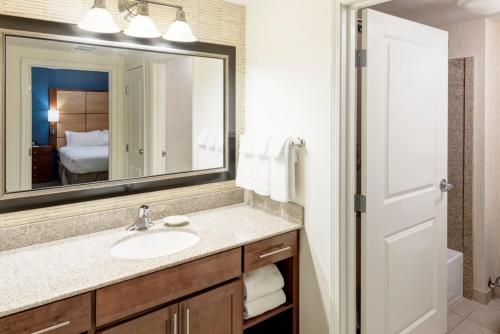 a bathroom with a sink and a mirror at Residence Inn South Bend Mishawaka in South Bend