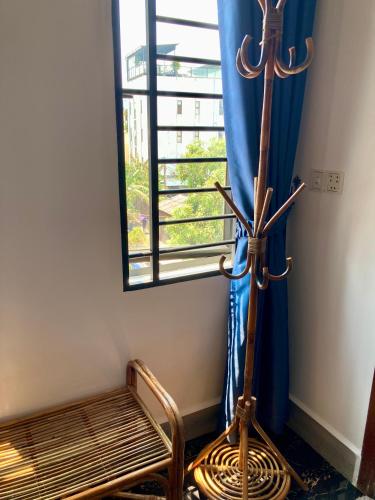 a room with a bench in front of a window at Lotus Haven Villa in Siem Reap