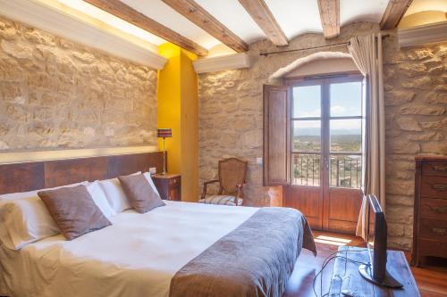 Postel nebo postele na pokoji v ubytování Hotel del Sitjar