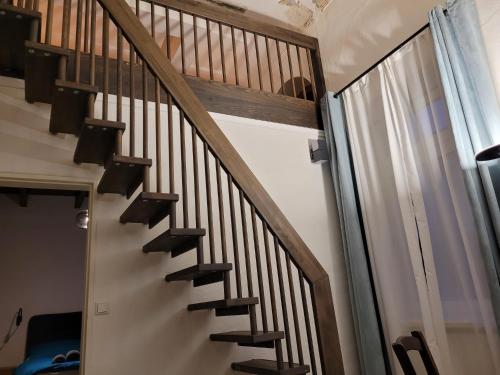 a staircase with wooden railings in a house at Hafen Deern in Flensburg