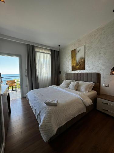 Postel nebo postele na pokoji v ubytování Luciano Hotel