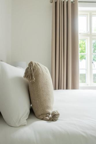 Postel nebo postele na pokoji v ubytování GuestReady - Modernised cottage in Monkstown