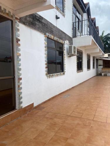 an outside view of a building with a patio at Rich Court rooms in Oko