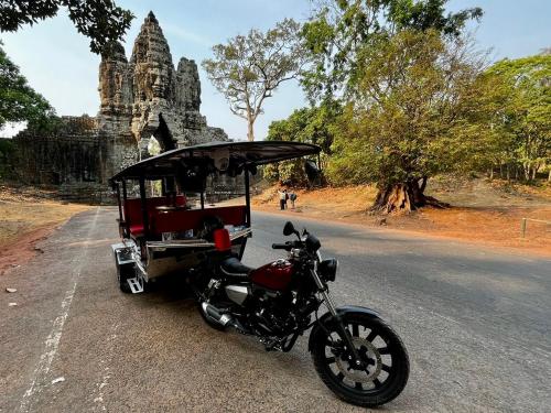 a motorcycle parked on the side of a road at Lotus Haven Villa in Siem Reap