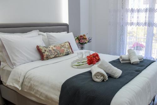 Ένα ή περισσότερα κρεβάτια σε δωμάτιο στο SunShine apartment