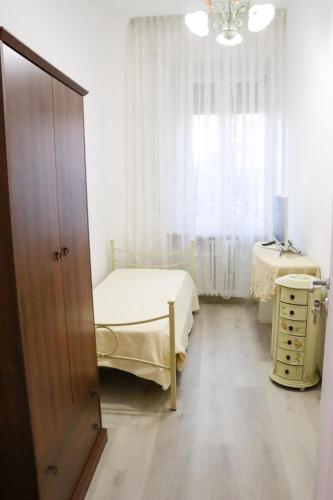 Postel nebo postele na pokoji v ubytování La Casa di Piccolì di Gabriele Martelli e Catia Pacetti - Camera Coccinella