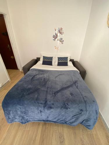 Säng eller sängar i ett rum på Appartement Nice Magnan