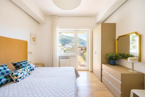 a bedroom with a bed and a window at Residence Panoramic in Maiori
