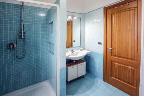 a bathroom with a sink and a shower at Il Cavalluccio Marino in Pontecagnano