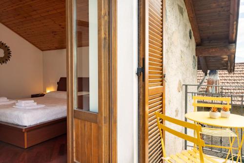 Ένα ή περισσότερα κρεβάτια σε δωμάτιο στο Gelsomino Stone House by Halldis