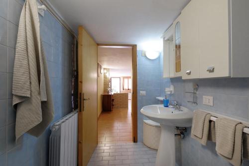 a bathroom with a sink and a toilet and a mirror at Vacanze Mare Teulada in Teulada