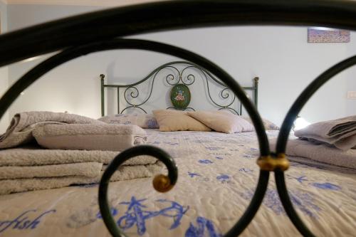 a close up of a bed with a metal frame at Vacanze Mare Teulada in Teulada