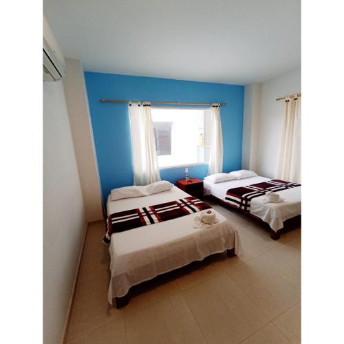 Postel nebo postele na pokoji v ubytování Hotel El Tesoro