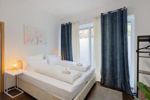 En eller flere senge i et værelse på ruhrApartments #Nähe A40 #zentral #fastWIFI #perfekt für Familien und Geschäftsreisen