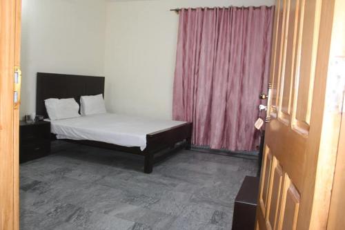 Krevet ili kreveti u jedinici u okviru objekta Kashmir Inn Hotel