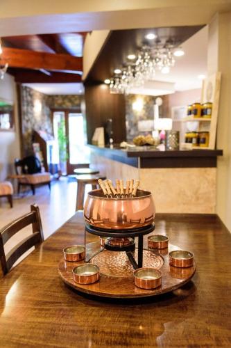 a tray of candles on a table in a room at Curahue Apart Hotel in Tandil