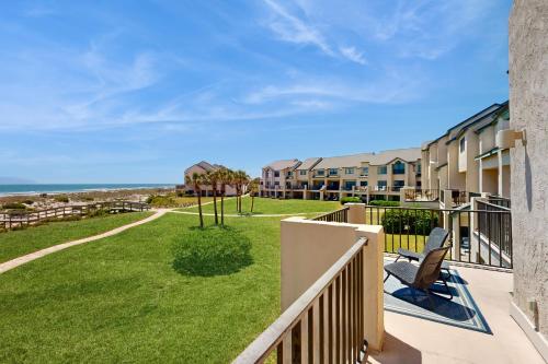a balcony with a view of the ocean from a condo at Sailmaker in Fernandina Beach