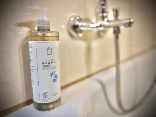a bottle of water sitting on a bathroom sink at G&G Homely Apartment Horhausen Westerwald - near A3 in Horhausen